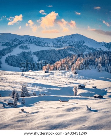 Snowy hills of Alpe di Siusi ski resort. Astonishing winter landscape of Dolomite Alps, Italy, Europe. Spectacular outdoor scene of Italian countryside. Beauty of nature concept background.