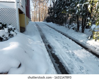 Snowy And Icy Driveway In Winter