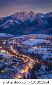 Snowy Illuminated Zakopane City At Night, Aerial View, Poland