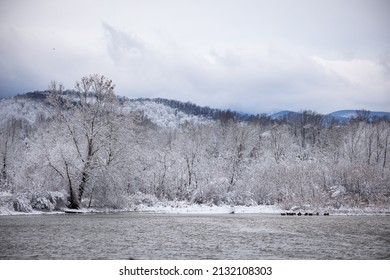 A Snowy Lakeside At The Foot Of The Shenandoah Mountains