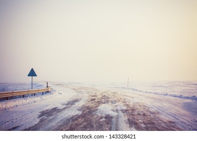 snowy land road at winter