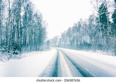 Snowy Land Road At Winter. Adverse Weather Conditions