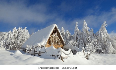 Snowy landscape with a rustic cabin, evergreen trees, and a sunny winter day setting. Peaceful winter scene - Powered by Shutterstock