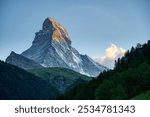 Snowy Matterhorn mountain in Swiss alps during sunset