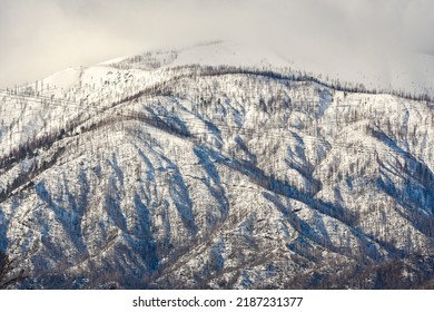 Snowy mountain capped with clouds