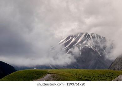 snowy mountain in the clouds