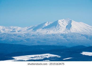 Snowy mountain peak and blue sky
 - Powered by Shutterstock