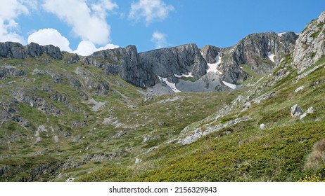 Snowy mountain peaks and green alpine meadows in Galicica National Park, North Macedonia, Europe. Idyllic Balkan mountain landscape.