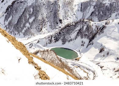 Snowy mountain peaks, Gudauri, Georgia. Jinvali Water Reservoir blue lake in Caucasian Mountain in winter. Cross Pass in Georgia. Gudauri District - Powered by Shutterstock