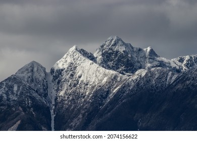 Snowy Mountain Top On A Cloudy Day