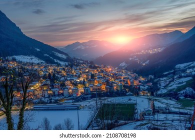 Snowy Mountain Village At Sunset