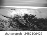 Snowy mountains, aerial view, black and white, Yukon, Canada