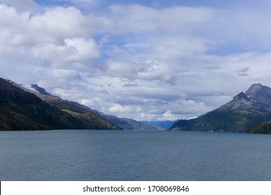 Snowy Mountains In Chilean Fjord With Blue Sky And Clouds, Strait Of Magellan