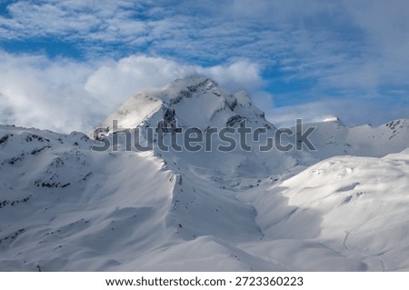Snowy mountains in dramatic light. Winter Landscape.