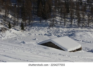 Snowy mountains with snow covered hut. Bergamo Alps, Italy - Shutterstock ID 2254277555