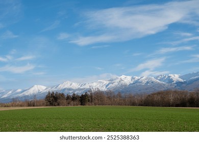 Snowy mountains and thickets in early winter against a blue sky
 - Powered by Shutterstock