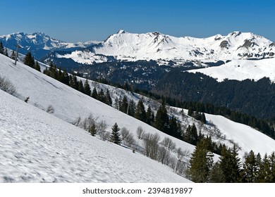 Snowy mountains in the UNESCO Geopark Chablais, Les Gets, Haute-Savoie, France