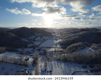 Snowy mountains while the sun is setting. 