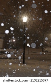 Snowy Neighborhood Street During Snow Storm At Night