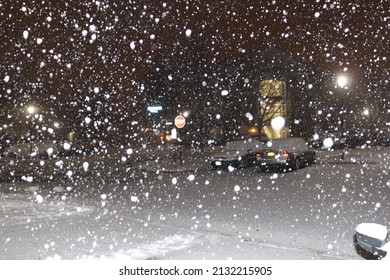 Snowy Neighborhood Street During Snow Storm At Night