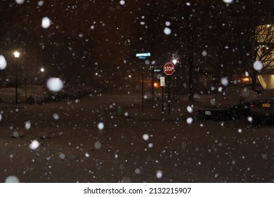 Snowy Neighborhood Street During Snow Storm At Night