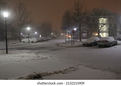 Snowy Neighborhood Street During Snow Storm At Night