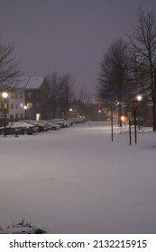 Snowy Neighborhood Street During Snow Storm At Night