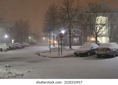 Snowy Neighborhood Street During Snow Storm At Night