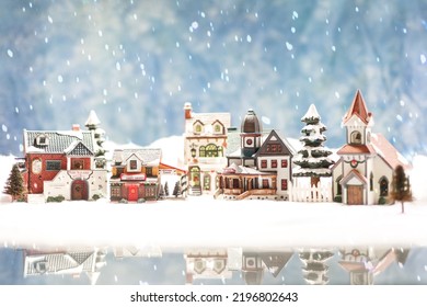 Snowy North Pole Santa's Village with reflection photo to make a festive Christmas holiday card or for xmas background