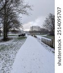 Snowy path in a park in England