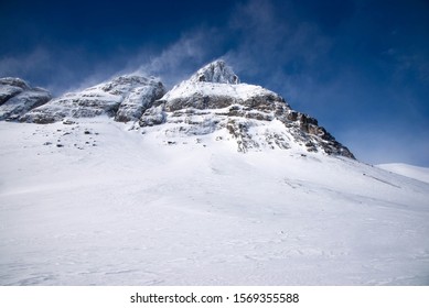 Snowy Peak Of Mountain. Winter. Wind, Blizzard And Snowstorm.  Russia, Kola Peninsula, Khibiny Mountains