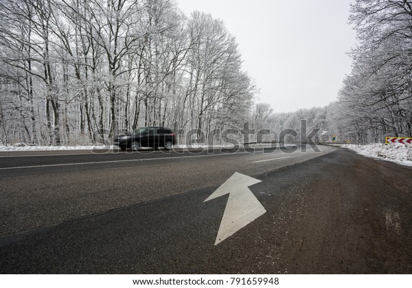 snowy road at cold\
wintertime