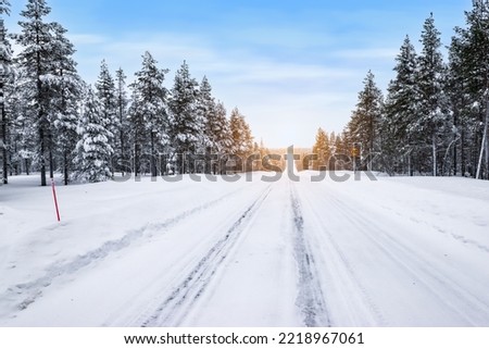 Snowy road landscape in Finland.