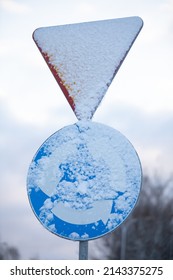 Snowy Road Sign, Intersection With Circular Traffic.