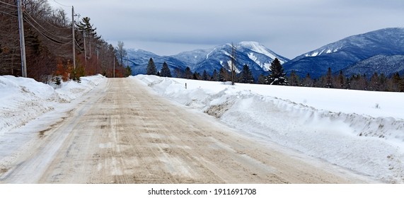 Snowy Road And Winter Landscape With Snow Covered Mountains And 46er High Peaks Popular For Hiking And Climbing, Adirondacks New York