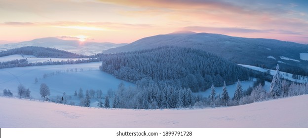 
Snowy trees in winter landscape. Orlicke mountains in winter, beautiful cold day near ski resort, Eastern Bohemia, Czech Republic. Trees covered with snow. - Shutterstock ID 1899791728