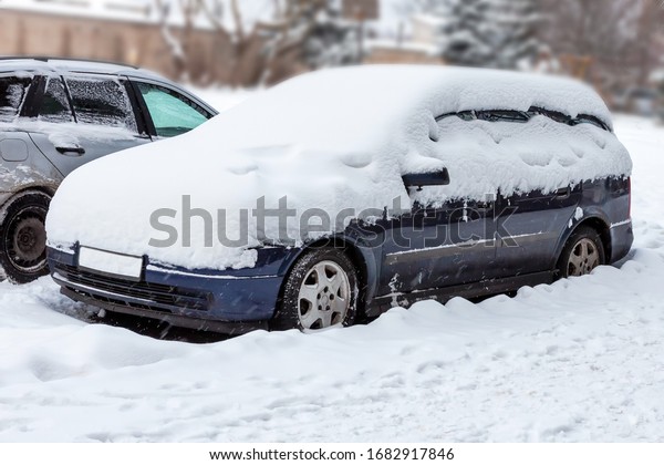 snowy vehicle in the\
yard