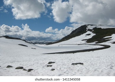 Snowy View Of Rallarvegen. Famous Bicycle Trail On Hardangervidda Plateau Leads You Along The Bergen Railway Line From Haugastøl To Flåm. Norway