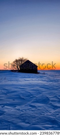 Snowy Winter Barn before Sunrise