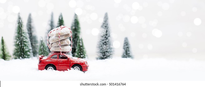 Snowy Winter Forest With Miniature Red Car Carrying Christmas Cookies