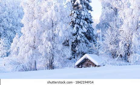 Snowy Winter Landscape Of Lapland. Wooden, Village Houses Covered With Thick Snow.