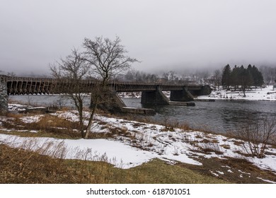 A Snowy, Winter Scene Of The Roebling Designed Delaware Aqueduct Along There Former Delaware And Hudson Canal Over The Delaware River Between Pennsylvania And New York.