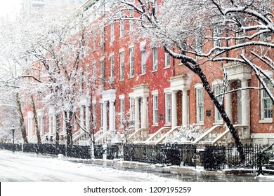 Snowy Winter Street Scene With Historic Buildings Along Washington Square Park In Manhattan, New York City NYC