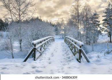 Snowy, wooden bridge in a winter day. Stare Juchy, Poland. - Powered by Shutterstock