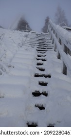 Snowy Wooden Stairs Outdoors In The Winter. Footsteps.