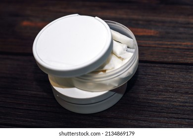 Snus Box With Nicotine Pouches On Wooden Background.