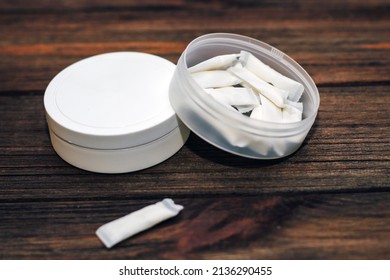 Snus Box With Nicotine Pouches On Wooden Background.