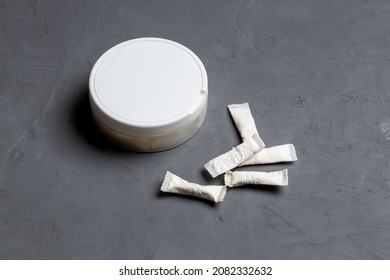 Snus Nicotine Pouch Product On Concrete Background. Outer Space. Chewing Nicotine Bags. Danger Unhealthy Addiction.