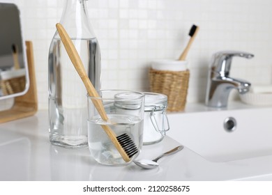 Soak A Toothbrush In The Solution Of Water, White Vinegar And Baking Soda For Cleaning And Disinfection.