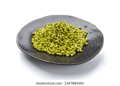 Soaked Mung Beans on Black Plate Isolated, Wet Vigna Radiata Seeds Pile, Macro Photo of Green Gram in Water, Raw Mung Beans, Maash or Moong, White Background